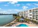 Inviting community pool with surrounding patio and lounge chairs at 7902 Sailboat Key S Blvd # 405, South Pasadena, FL 33707
