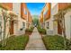 Neat landscaping lines a walkway between the townhomes at 855 3Rd N Ave, St Petersburg, FL 33701