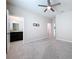 Bedroom with ceiling fan and access to bathroom at 10703 Bridgegate Heights Loop, San Antonio, FL 33576