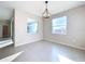 Bright dining room with large windows and chandelier at 10703 Bridgegate Heights Loop, San Antonio, FL 33576