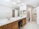 Modern bathroom with a double vanity and shower at 18329 Cypress Stand Cir, Tampa, FL 33647