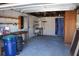 Attached garage with workbench, storage, and water heater at 215 176Th Terrace E Dr, Redington Shores, FL 33708