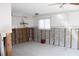Renovation in progress: kitchen with tiled floors and exposed walls at 215 176Th Terrace E Dr, Redington Shores, FL 33708