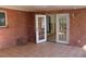 Screened porch with terracotta tile floor and access to home interior at 215 176Th Terrace E Dr, Redington Shores, FL 33708
