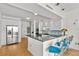 Kitchen with stainless steel appliances, island bar, and blue bar stools at 226 5Th N Ave # 1502, St Petersburg, FL 33701