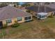 Rear view of the house with sunroom and large backyard at 2311 Nottingham Greens Dr # 2311, Sun City Center, FL 33573