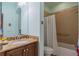 Bathroom with shower/tub combo, granite vanity, and grab bar at 2311 Nottingham Greens Dr # 2311, Sun City Center, FL 33573