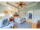 Cozy bedroom with ceiling fan and access to a walk-in closet at 2311 Nottingham Greens Dr # 2311, Sun City Center, FL 33573