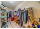 Large walk-in closet with ample shelving and hanging space at 2311 Nottingham Greens Dr # 2311, Sun City Center, FL 33573
