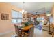 Kitchen dining area with round table and view of living room at 2311 Nottingham Greens Dr # 2311, Sun City Center, FL 33573