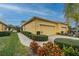 Villa with two-car garage and manicured landscaping at 2311 Nottingham Greens Dr # 2311, Sun City Center, FL 33573