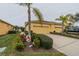 Villa featuring a two-car garage and well-maintained landscaping at 2311 Nottingham Greens Dr # 2311, Sun City Center, FL 33573