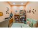 Home office with bookcase, desk, and comfortable seating at 2311 Nottingham Greens Dr # 2311, Sun City Center, FL 33573