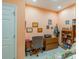 Bright home office features built-in shelving and a desk at 2311 Nottingham Greens Dr # 2311, Sun City Center, FL 33573