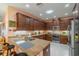 Spacious kitchen with granite countertops and modern cabinetry at 2311 Nottingham Greens Dr # 2311, Sun City Center, FL 33573