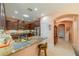 Modern kitchen with stainless steel appliances and breakfast bar at 2311 Nottingham Greens Dr # 2311, Sun City Center, FL 33573