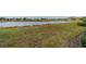 View of lake and neighborhood from backyard at 2311 Nottingham Greens Dr # 2311, Sun City Center, FL 33573