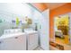 Laundry room with washer, dryer, and shelving at 2311 Nottingham Greens Dr # 2311, Sun City Center, FL 33573