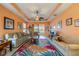 Spacious living room featuring a ceiling fan and access to a lanai at 2311 Nottingham Greens Dr # 2311, Sun City Center, FL 33573