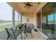 Sunroom with lake view and access to outdoors at 2311 Nottingham Greens Dr # 2311, Sun City Center, FL 33573