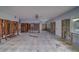 Under renovation, this living room shows new flooring at 2480 Del Rio Way, Dunedin, FL 34698