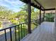 Private balcony overlooking a tree-lined street at 3031 Countryside Blvd # 35C, Clearwater, FL 33761