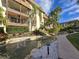 Peaceful water feature and walkway in a tropical setting at 3031 Countryside Blvd # 35C, Clearwater, FL 33761