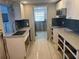 Renovated kitchen featuring new cabinets and countertops at 3132 Phoenix Ave, Oldsmar, FL 34677