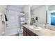 Clean bathroom with tub, shower, and granite vanity at 32619 Turtle Grace Loop, Wesley Chapel, FL 33545