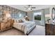 Spacious bedroom with patterned wall and ample light at 32619 Turtle Grace Loop, Wesley Chapel, FL 33545
