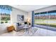 Bright living room with water views and sliding glass doors at 32619 Turtle Grace Loop, Wesley Chapel, FL 33545