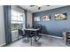 Home office with a large window and modern furniture at 32619 Turtle Grace Loop, Wesley Chapel, FL 33545