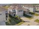 Two-story house with gray siding, a garage, and a well-manicured lawn at 3281 Suncoast Plains Dr, Odessa, FL 33556