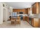 Spacious kitchen with an island, stainless steel appliances, and wood cabinets at 4275 Caskie Pl, Brooksville, FL 34604