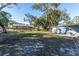Large backyard with grassy area and neighboring homes visible at 4825 Dr Martin Luther King Jr S St, St Petersburg, FL 33705