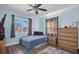 Bedroom with double bed, dresser and ceiling fan at 4825 Dr Martin Luther King Jr S St, St Petersburg, FL 33705