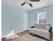 Light blue bedroom with a sofa bed and ceiling fan at 4825 Dr Martin Luther King Jr S St, St Petersburg, FL 33705