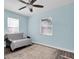Light blue bedroom with a sofa bed and ceiling fan at 4825 Dr Martin Luther King Jr S St, St Petersburg, FL 33705