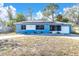 Cute blue house with solar panels and a spacious yard at 4825 Dr Martin Luther King Jr S St, St Petersburg, FL 33705