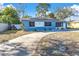 House front with driveway and solar panels at 4825 Dr Martin Luther King Jr S St, St Petersburg, FL 33705