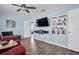 Living room with a large TV and built-in shelving at 4825 Dr Martin Luther King Jr S St, St Petersburg, FL 33705