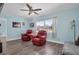 Living room with two red armchairs and wood floors at 4825 Dr Martin Luther King Jr S St, St Petersburg, FL 33705