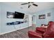 Living room with a large TV and built-in shelving at 4825 Dr Martin Luther King Jr S St, St Petersburg, FL 33705