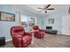 Living room with two red armchairs and wood floors at 4825 Dr Martin Luther King Jr S St, St Petersburg, FL 33705