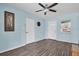Living room with a dartboard and light blue walls at 4825 Dr Martin Luther King Jr S St, St Petersburg, FL 33705