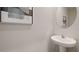 Convenient half bathroom with pedestal sink and mirror at 483 Mangrove Shade Cir, Apollo Beach, FL 33572