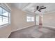 Spacious bedroom with carpet, ceiling fan, and large windows at 4851 W Gandy Blvd # B6 L3, Tampa, FL 33611