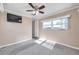 Bedroom with ceiling fan, carpet, and window at 4851 W Gandy Blvd # B6 L3, Tampa, FL 33611