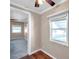 Simple bedroom with window, wood floor, and view to another room at 4851 W Gandy Blvd # B6 L3, Tampa, FL 33611