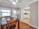 Dining area with view into kitchen, both with wood flooring at 4851 W Gandy Blvd # B6 L3, Tampa, FL 33611